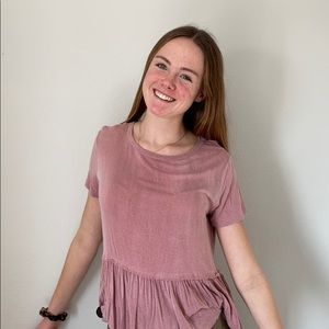 Pink flowy top with ruffles at end